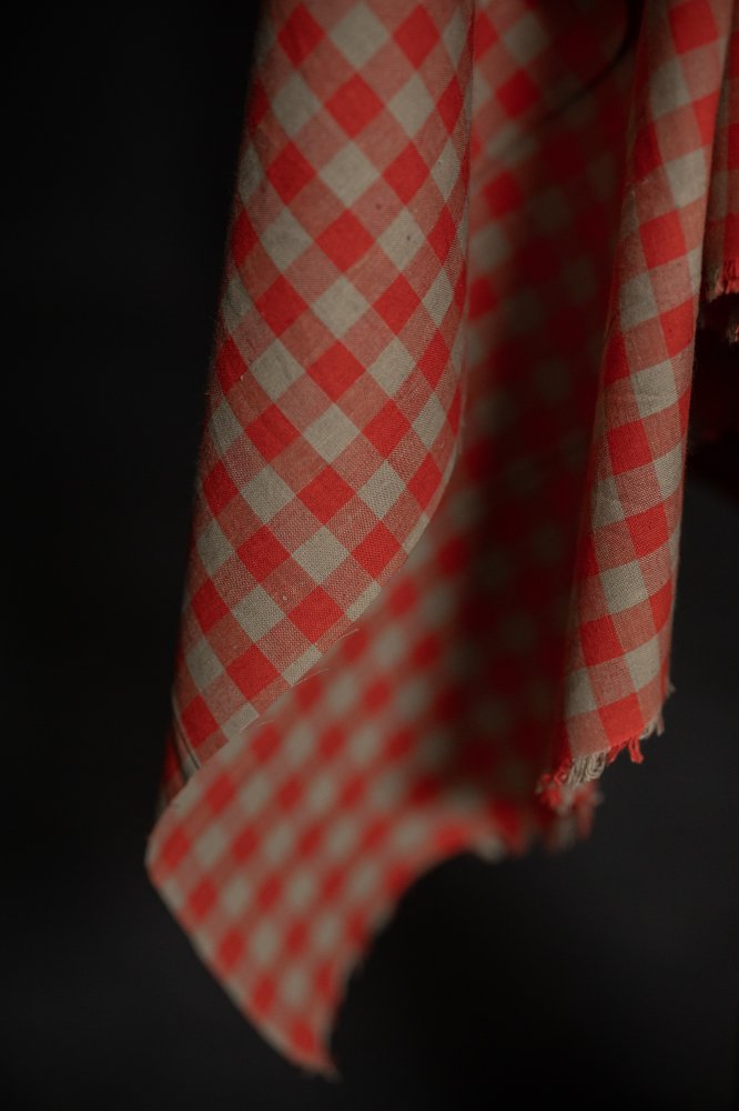 Betsy Organic Cotton Linen Gingham fabric draped elegantly, ideal for lightweight curtains and apparel, from Merchant & Mills.