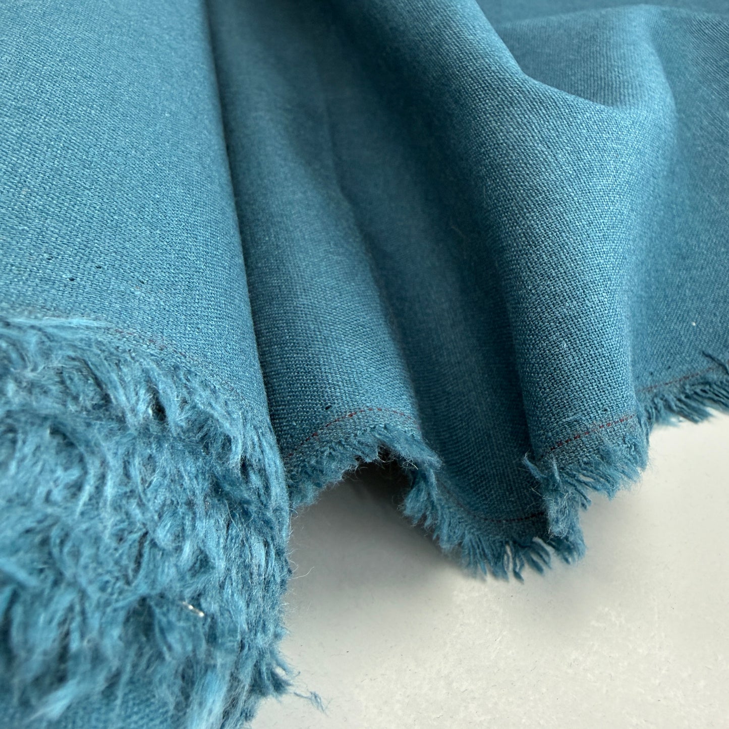 Linen + Viscose + Poly Mix in Ocean Teal from Simplifi Fabric, showcasing the beautiful texture and color of the fabric suitable for apparel and home decor.