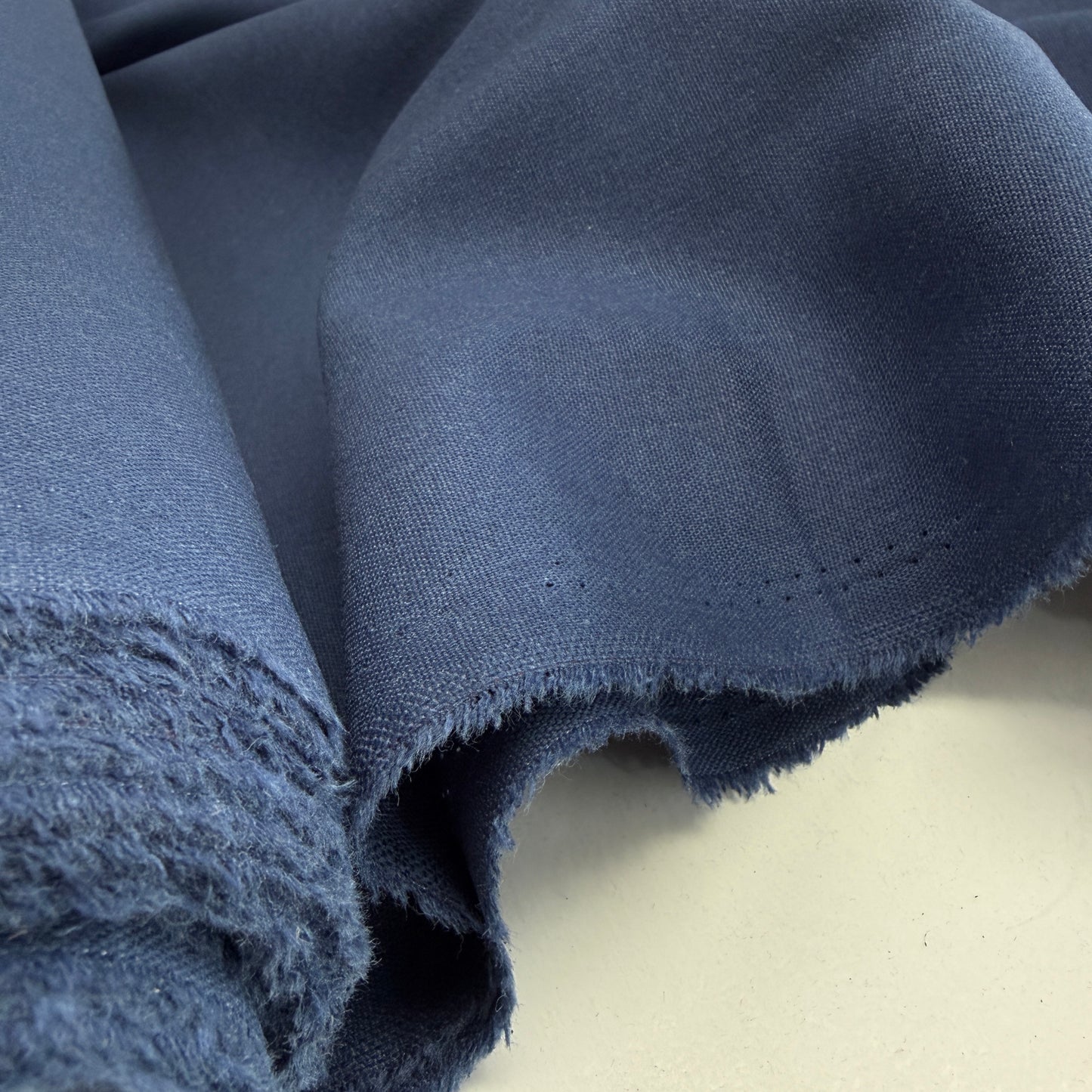 Linen + Viscose + Poly Mix - Classic Indigo fabric, showcasing its breathable texture and smooth drape, perfect for apparel and home sewing projects.