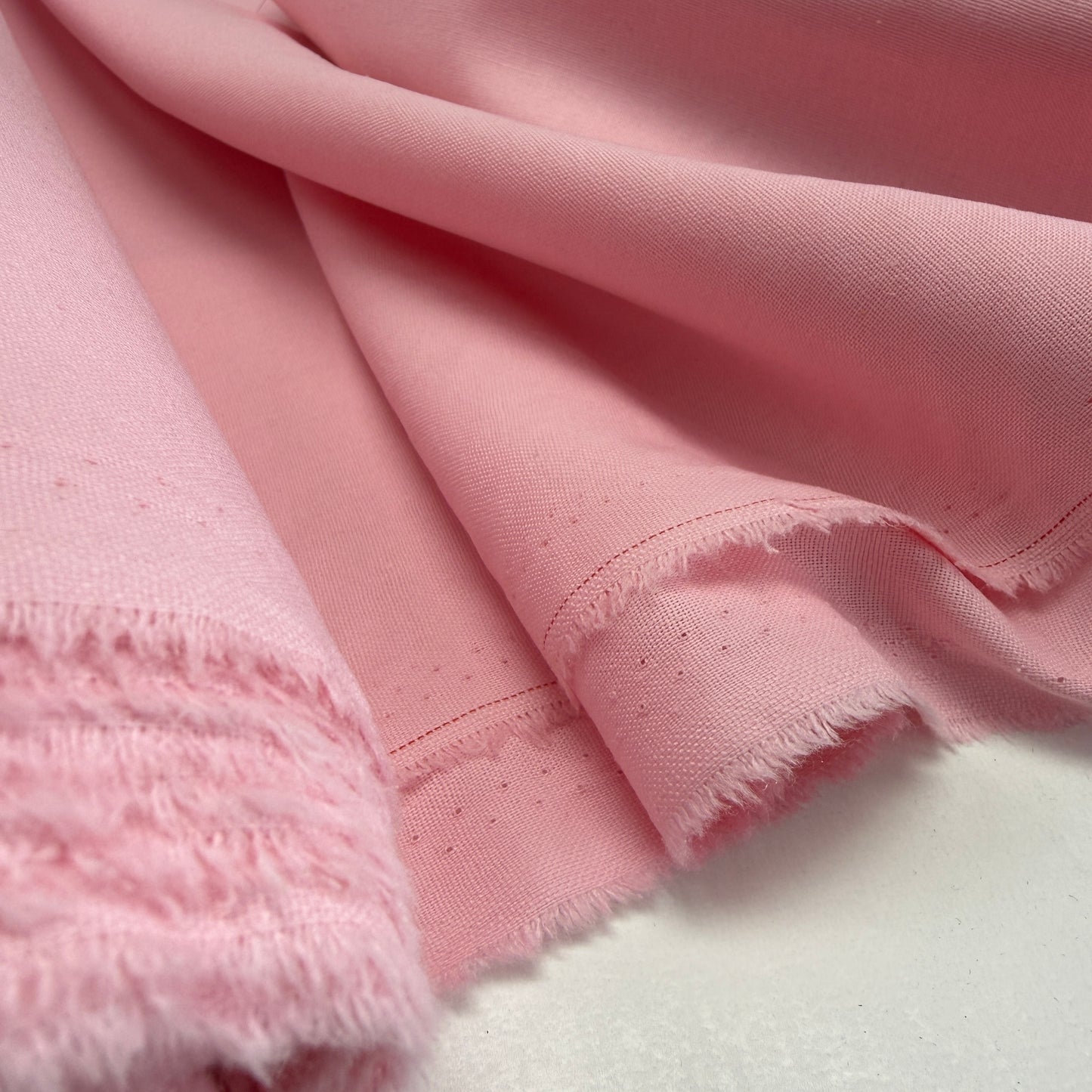 Linen + Viscose + Poly Mix - Pink Fluff fabric swatch showcasing its soft texture and beautiful pink color, ideal for dresses, blouses, and home decor projects.