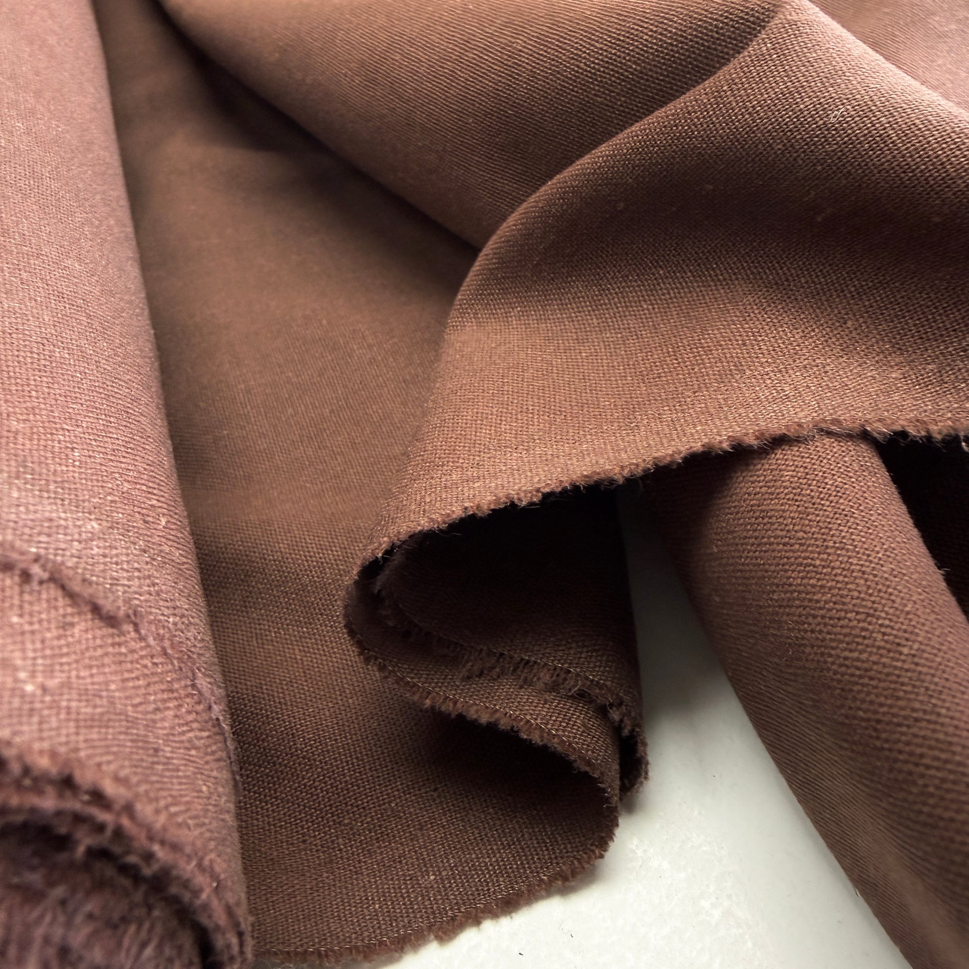 Cocoa Brown Linen + Viscose + Poly Mix fabric by Simplifi Fabric, showcasing its soft texture and drape perfect for apparel and home decor projects.